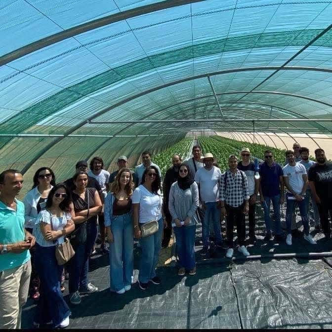 Group visit inside a La Ferme Urbaine hydroponic greenhouse